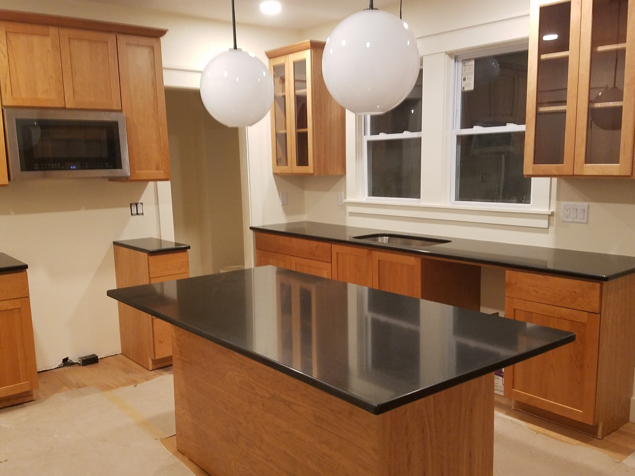 Custom Kitchen Cabinets with Black Quartz Countertops