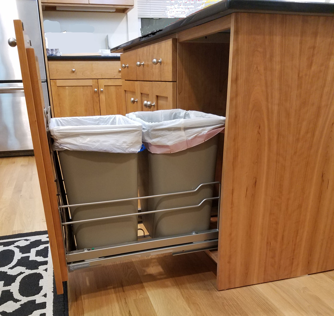 Custom Kitchen Cabinets with Black Quartz Countertops