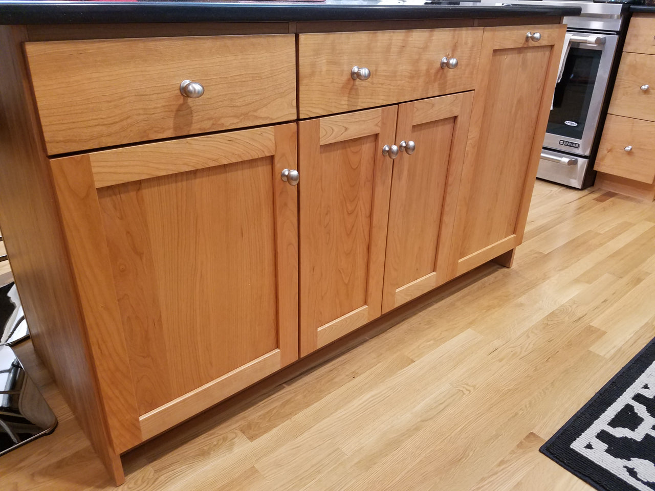 Custom Kitchen Cabinets with Black Quartz Countertops